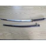 A WW2 JAPANESE OFFICERS SAMURAI SWORD, with gilded fittings and metal saya