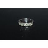 A HALLMARKED 18 CARAT WHITE GOLD SEVEN STONE DIAMOND ETERNITY RING, estimated total carat weight 1.