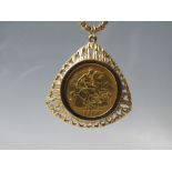 A 1910 EDWARD VII SYDNEY MINT GOLD HALF SOVEREIGN COIN IN 9CT GOLD PENDANT MOUNT, suspended on a 9ct