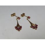 A PAIR OF 9CT GOLD PINK AND CLEAR GEM SET EARRINGS