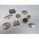 A COLLECTION OF NINE HALLMARKED SILVER AND 925 PILL BOXES, to include a handbag shaped example and a