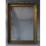 AN EARLY 20TH CENTURY GOLD FRAME WITH LEAF DESIGN TO OUTER EDGE, frame W 8.5 cm, rebate 92 x 61