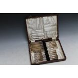 A CASED SET OF TWELVE HALLMARKED SILVER FISH KNIVES AND FORKS BY THOMAS BISHTON - BIRMINGHAM 1925,