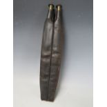 A 19TH CENTURY LEATHER DOUBLE POWDER FLASK WITH STRAP, L 41 cm, W 9 cm