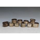 TEN ASSORTED HALLMARKED SILVER NAPKIN RINGS, various dates and makers, approx combined weight 300g