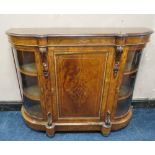 A VICTORIAN WALNUT CREDENZA, having a central inlaid single door flanked by two arched glass