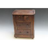A TABLE TOP MAHOGANY CHEST OF DRAWS CONTAINING A SHELL COLLECTION, H 43 cm