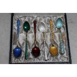 A CASED SET OF SIX HARLEQUIN ENAMEL SILVER GILT COFFEE SPOONS, stamped 'ELa Denmark STERLING 925