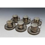 A SET OF SIX HALLMARKED SILVER COFFEE CUPS AND SAUCERS BY WILLIAM HUTTON & SONS LTD - LONDON 1905,