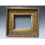 AN 18TH CENTURY GOLD HINGED CABINET FRAME, with acanthus leaf design, frame W 11 cm, rebate 25 x