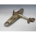 A VINTAGE CLOCKWORK TIN PLATE PROPELLER AEROPLANE, with retractable wings, L 30 cm, W 43 cm with
