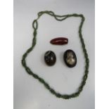 A VINTAGE BANDED AGATE BROOCH, together with a double twisted strand spinach jade type bead necklace