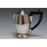 A DESIGNER HALLMARKED SILVER WATER JUG - BIRMINGHAM 1932, makers mark indistinct, finial absent from