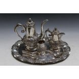 A COLLECTION OF ARABIC 800 STAMPED SILVER TEAWARE, to include a serving tray and set of six