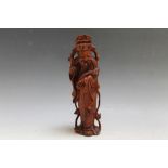 A CARVED CHINESE FIGURE, H 21 cm