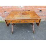 A 19TH CENTURY SOFA TABLE, having inlaid rosewood crossbanding and brass detail, raised on carved