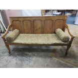 A 19TH CENTURY OAK PANELLED SETTLE, having five panel back, with altered seat, raised on thick