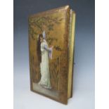 A PHOTOGRAPH ALBUM DATED 1916 ON INNER COVER, with mixed media painting of a young woman in