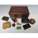 A VINTAGE OAK LIDDED BOX AND CONTENTS, containing a selection of collectable boxes etc., to