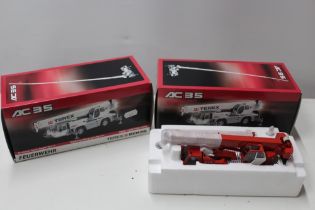 TWO BOXED TEREX DEMAG 1:50 SCALE MOBILE CRANES