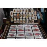 A QUANTITY OF FIRE RELATED PLAYERS CIGARETTE CARDS, two framed frameability fire engine card sets,