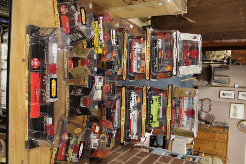 SIXTEEN BOXED CODE 3 COLLECTABLES FIRE ENGINES, 1:64 scale, all limited edition, to include