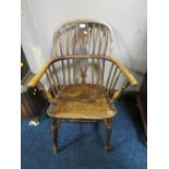 A SMALL 19TH CENTURY ELM WINDSOR ARMCHAIR