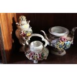 THREE CONTINENTAL ELABORATE CERAMIC PIECES TO INCLUDE A LIDDED TWIN HANDLED URN
