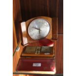 A DECO STYLE WESTCLOX MANTLE CLOCK TOGETHER WITH A CASED ESTYMA RADIO ALARM CLOCK AND A SMALL TRAVEL