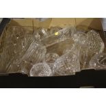 A TRAY OF ASSORTED CUT GLASS DECANTERS ETC