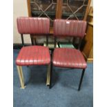 A PAIR OF RED LEATHER MODERN DINING CHAIRS