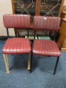 A PAIR OF RED LEATHER MODERN DINING CHAIRS