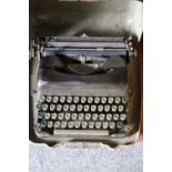 A DECO CASED PORTABLE TYPEWRITER