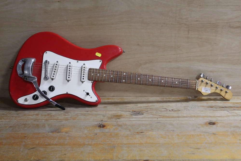 A RED THREE SINGLE COIL PICK UP FENDER STYLE ELECTRIC GUITAR WITH WHAMMY BAR