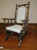 A CHILDS EDWARDIAN AMERICAN STYLE ROCKING CHAIR