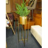 A MODERN GOLD PLANT STAND WITH FAKE FERN