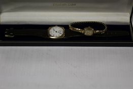 A VINTAGE WALTHAM U.S.A YELLOW METAL WRIST WATCH, PROBABLY GOLD, ON REPLACEMENT STRAP, TOGETHER WITH