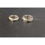 TWO 9CT GOLD AND SILVER ETERNITY RINGS