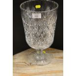 A LARGE CUT GLASS FOOTED VASE