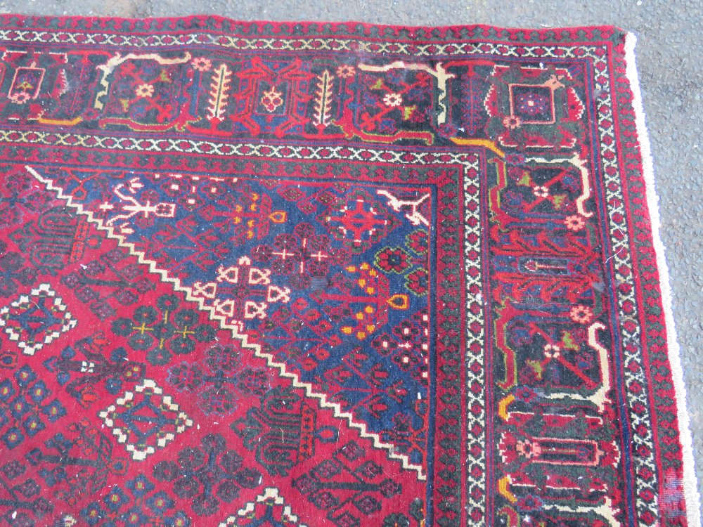 A LARGE IRANIAN CARPET - NAVY GROUND, APPROX 330 X 215 CM - WEAR THROUGHOUT - Image 7 of 10