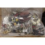 A LARGE BAG OF ASSORTED COSTUME JEWELLERY