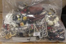 A LARGE BAG OF ASSORTED COSTUME JEWELLERY