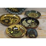 A COLLECTION OF STUDIO POTTERY STYLE DISHES SIGNED TO REVERSE HAMPTON 73