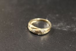 A 9CT GOLD DIAMOND SET DRESS RING