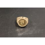 A HALLMARKED 9 CARAT GOLD RING SET WITH A 1 TALLAR COIN DATED 1853