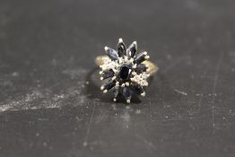 A 9CT GOLD LARGE SAPPHIRE CLUSTER DRESS RING
