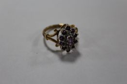 A HALLMARKED 9 CARAT GOLD DRESS RING SET WITH AMETHYST STONES, RING SIZE L, APPROX WEIGHT 3.2G