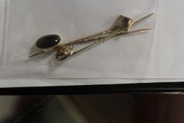 THREE GOLD STICK PINS TO INCLUDE A CABOCHON SET 15CT EXAMPLE