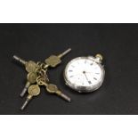 A SMALL FOB WATCH TOGETHER WITH A SELECTION OF POCKET WATCH KEYS