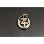 A VICTORIAN ENAMELLED MOURNING LOCKET